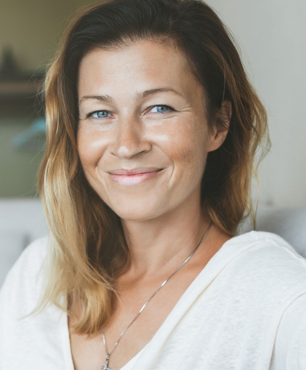 Portrait of a smiling female doctor in white coat.