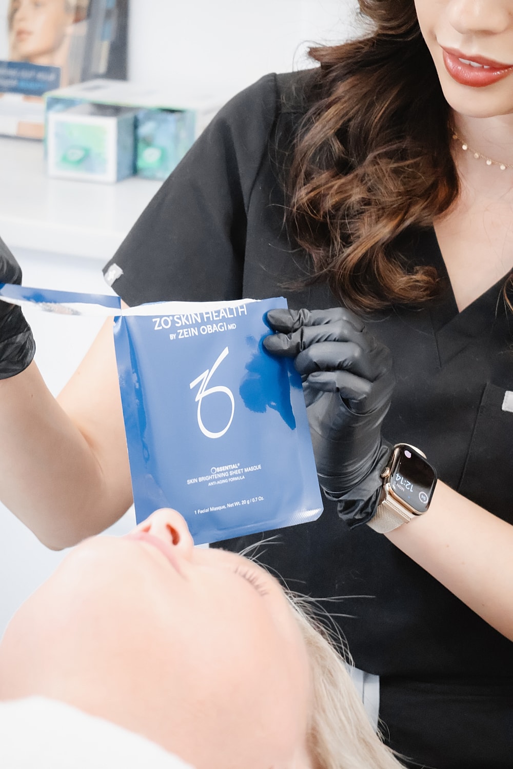 Skin care treatment with ZO Skin Health product.