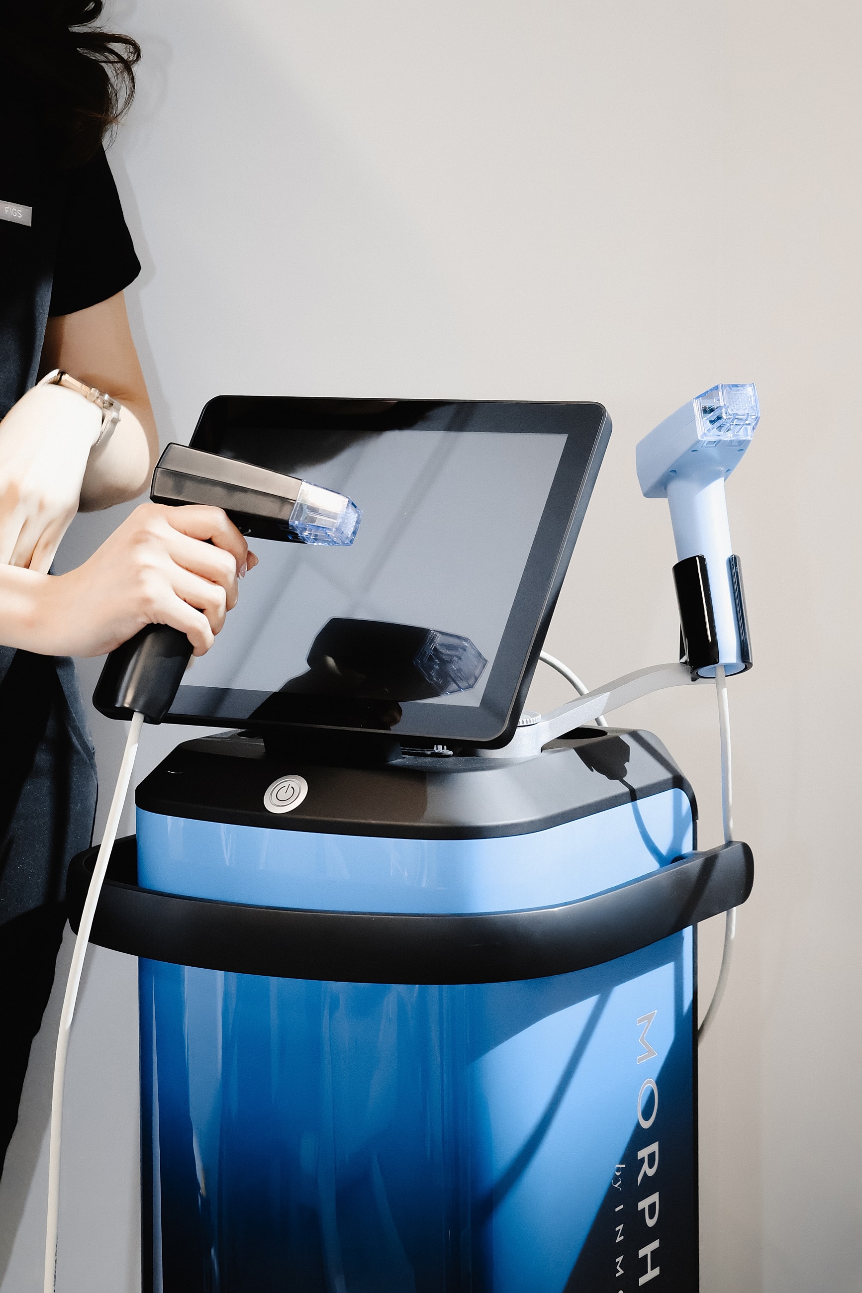 Skincare device with user-operated handpieces.