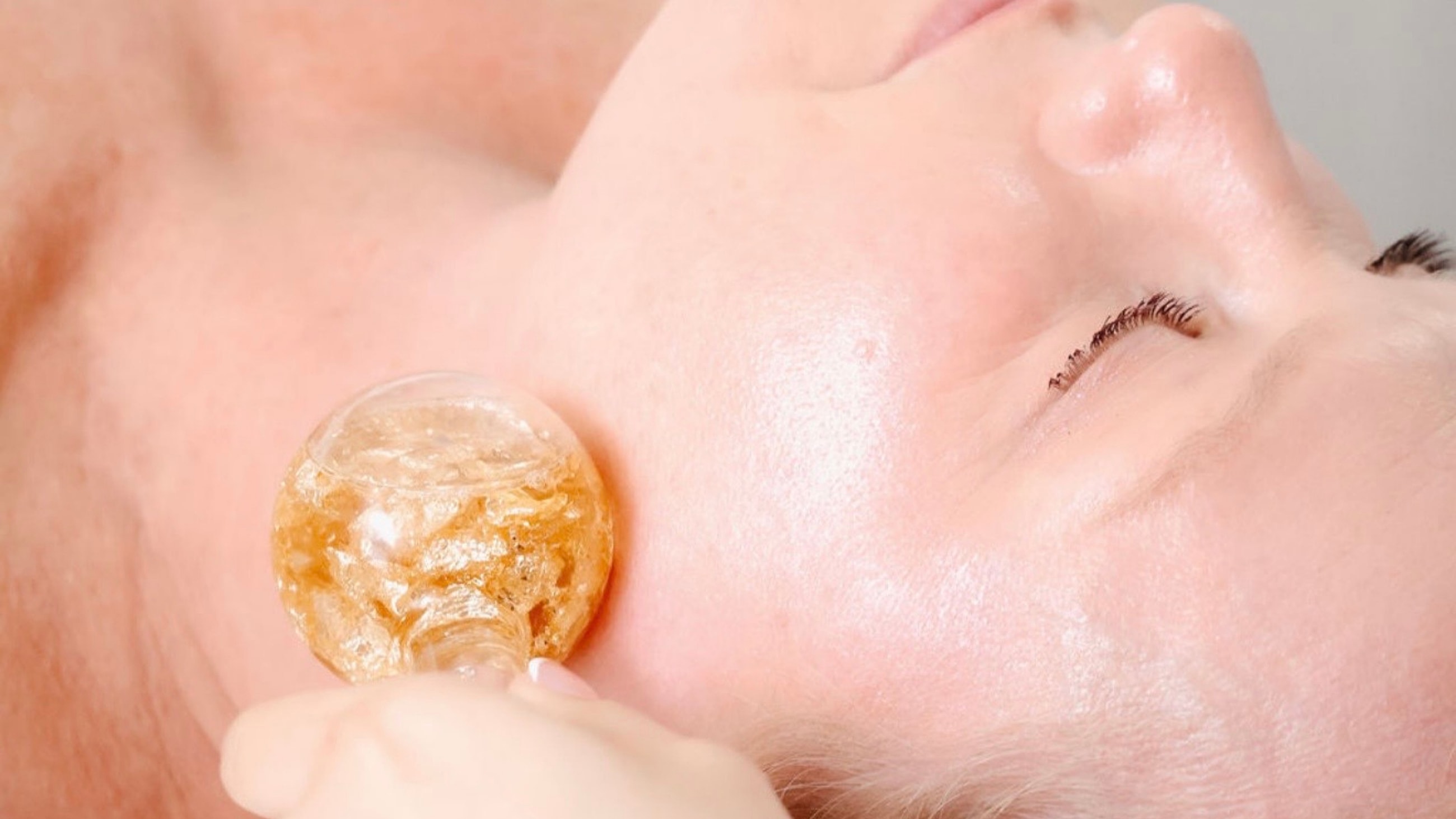 Woman relaxing with steam treatment for skin.