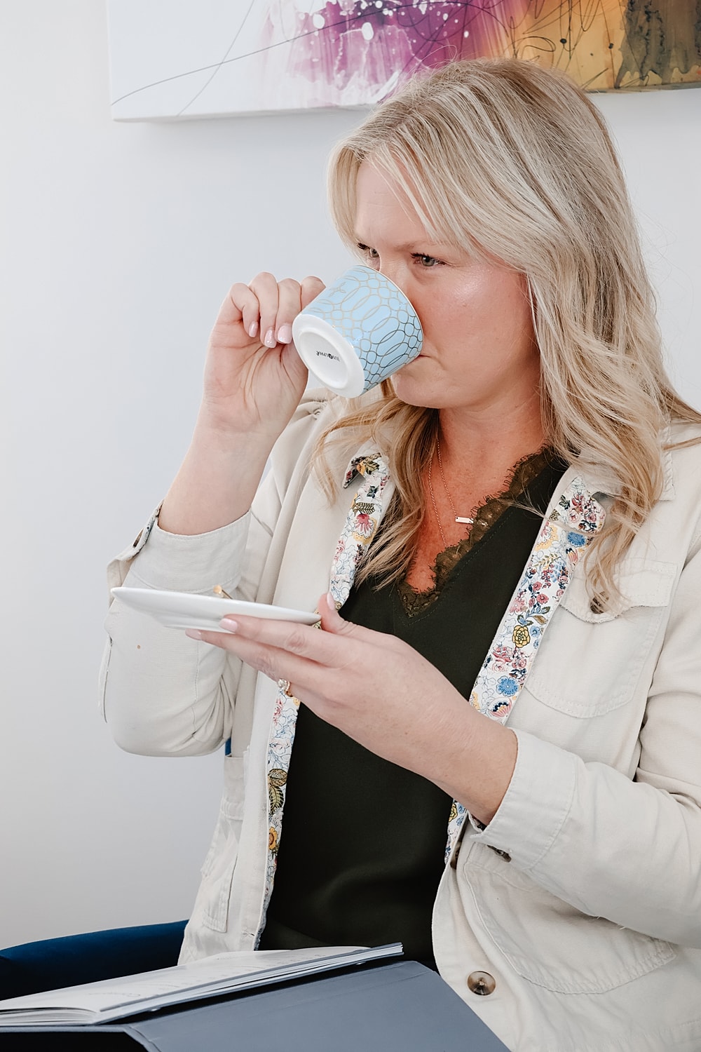 Woman sipping coffee while seated comfortably